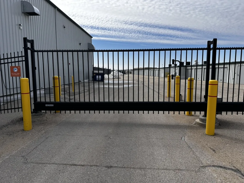 Commercial automatic slide gate with bollards